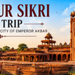 "Panoramic view of Fatehpur Sikri featuring Buland Darwaza, Mughal palaces, and historic courtyards during a day trip to Emperor Akbar's UNESCO World Heritage ghost city."